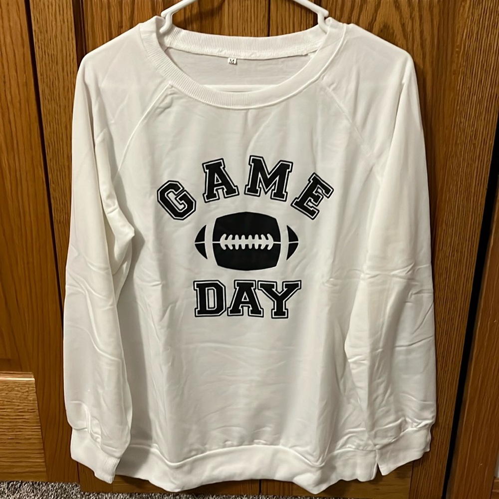 Brand New!! Never worn. White long sleeve Game Day sweater. Size Medium